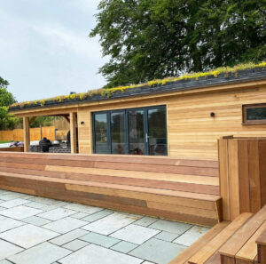 Wooden outdoor building with living roof